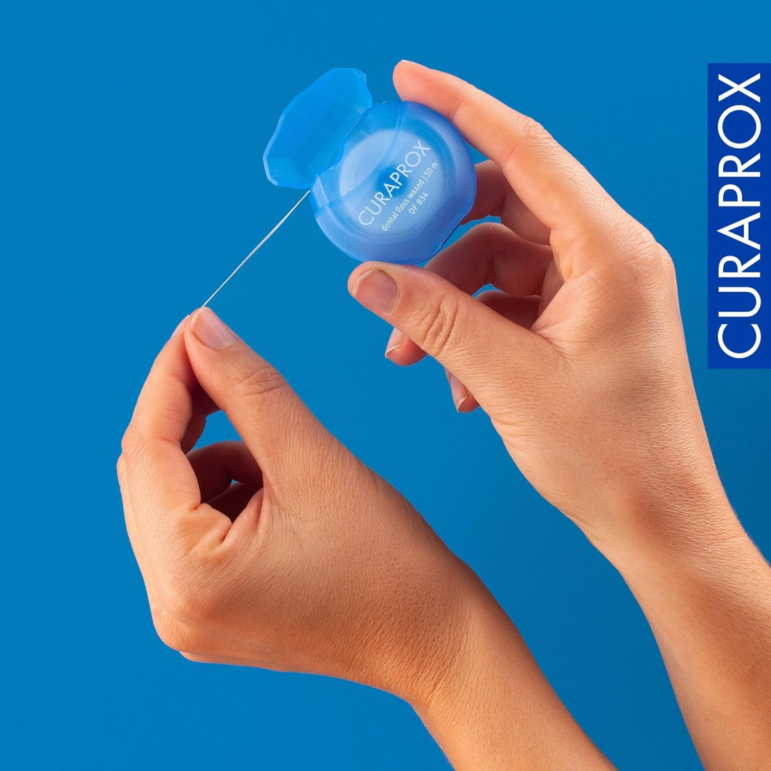 Зубна нитка Curaprox вощена з ароматом м'яти, 50 м